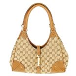 GUCCI - a Nailhead Bardot handbag. Designed with a beige GG monogram exterior and textured brown