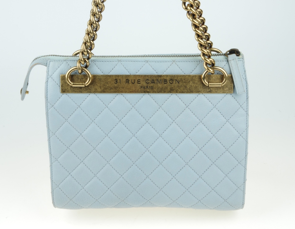 CHANEL - a quilted leather handbag. Designed with a pale blue quilted leather exterior and aged - Image 7 of 11