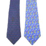 HERMÈS - two silk ties. Featuring a floral pattern of yellow flowers and red cherries on a powder