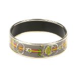 HERMÈS - a 'Concours d'Eterier' grey enamel bangle. The equestrian themed design depicting