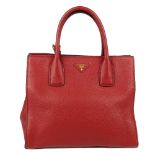 PRADA - a Vitello Daino Twin Pocket handbag. Crafted from burgundy grained calfskin leather, with