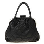 CHANEL - an Expandable Frame Stitch handbag. Crafted from black leather with oversized diamond