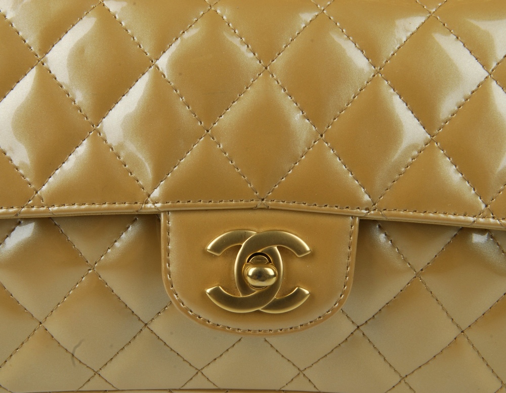 CHANEL - a gold patent leather flap handbag. Featuring a diamond quilted gold patent leather - Image 9 of 9