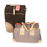 RADLEY - a small rolling suitcase and a travel bag. The brown nylon suitcase decorated with circular