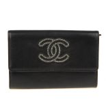 CHANEL - a CC chain trim wallet. Crafted from soft black lambskin leather, featuring maker's CC logo