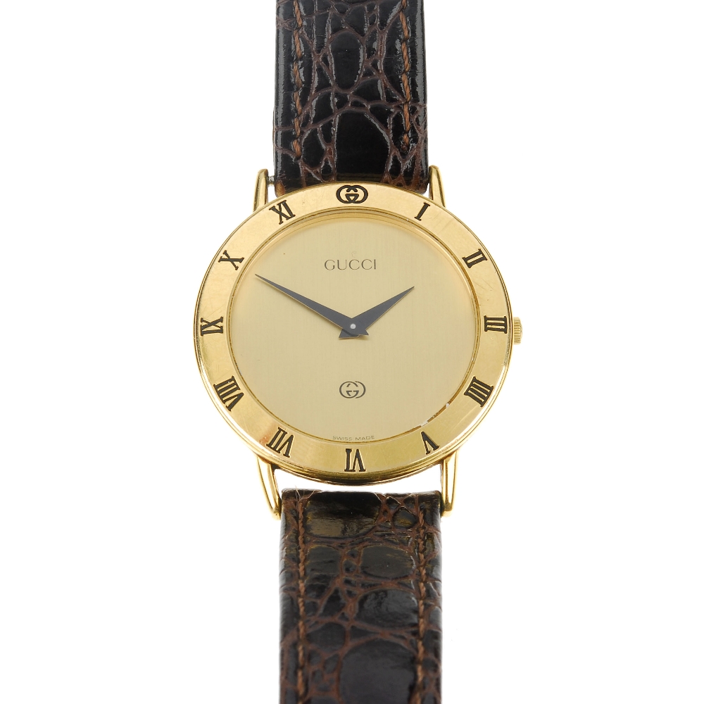 GUCCI - a gold plated quartz gentleman's 3000M wrist watch. The plain gold-tone dial, circular