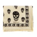 ALEXANDER MCQUEEN - a scarf. The cream silk and wool blend scarf, designed with maker's signature