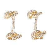 HERMÈS - a pair of Twisted Rope Knot cufflinks. The silver-tone cufflinks with gold plated detail