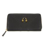 YVES SAINT LAURENT - a black leather Muse wallet. Featuring a black calfskin leather exterior with