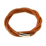HERMÈS - a brown leather twisted bracelet. The slip-on bracelet, crafted from twisted brown