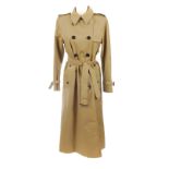 AQUASCUTUM - a woman's classic beige full-length trench coat. Designed with a notched lapel