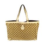 GUCCI - an Abbey handbag. Crafted of maker's GG beige monogram canvas, with ivory leather trim,