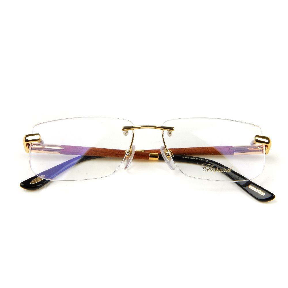 CHOPARD - a pair of rimless glasses. Featuring rimless demo print lenses, wooden arms with gold-tone