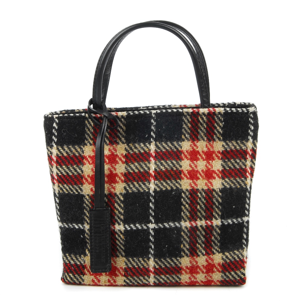 BURBERRY - a small woollen handbag. Featuring a black, cream and red plaid woollen exterior, with