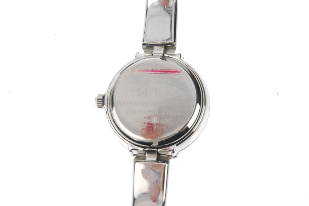 GUCCI - a stainless steel quartz lady's 1400L bangle watch. The plain black dial, with a round case, - Image 4 of 7