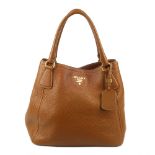 PRADA - a tan Vitello Daino Sacca 2 Mancini handbag. Featuring a tan pebbled leather exterior,