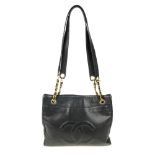 CHANEL - a Caviar leather handbag. The square tote with padded 'CC' logo to the front flat pocket, a