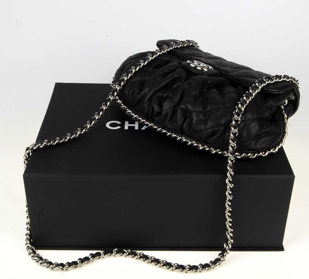 CHANEL - a Chain Around Flap handbag. Crafted from black quilted leather, featuring soft pleats to - Image 15 of 15