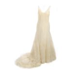 VERA WANG - an ivory sleeveless Veronique wedding dress with unbranded veil and tiara. The ivory