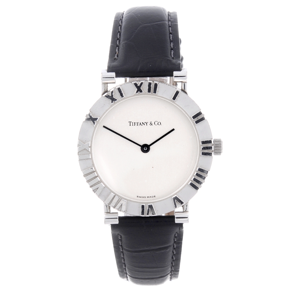 TIFFANY & CO. - a gentleman's Atlas wrist watch. Featuring a white metal case with chapter ring