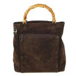 GUCCI - a vintage suede bamboo handle handbag. Crafted from brown suede, featuring two looping