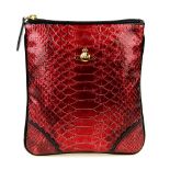 VIVIENNE WESTWOOD - a Frilly Snake crossbody handbag. Designed with a pink faux snakeskin exterior