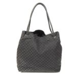 GUCCI - a large GG canvas handbag. Crafted from maker's black monogram canvas with black leather