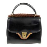 GUCCI - a vintage black leather handbag. Designed with a structured shape, featuring textured wooden