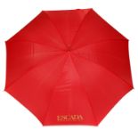 ESCADA - three umbrellas. To include two lightweight walking umbrellas, one with a red canopy, one
