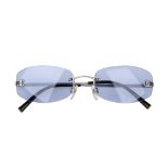 CHANEL - a pair of frameless blue sunglasses. Designed with narrow rimless blue tinted lenses,
