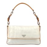 PRADA - a cream Tessuto nylon handbag. The cream nylon bag with tan leather trim and top handle,