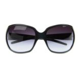 DOLCE & GABBANA - a pair of sunglasses. Designed with black acetate frames, oversized dark blue