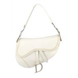 CHRISTIAN DIOR - an ivory leather saddle handbag. Designed with a pebbled ivory leather exterior and