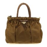 PRADA - a Tessuto gathered handbag. Featuring a ruched khaki nylon body with brown leather trim,