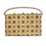 An early 20th century gem-set evening handbag attributed to Van Cleef & Arpels. The gold textile