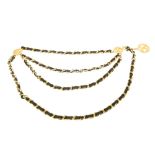 CHANEL - a chain belt. Designed as a gold-tone curb-link chain, interwoven with black leather,