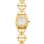 GUCCI - a lady's gold plated quartz bracelet watch. With round white dial, the cushion case with