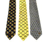 Three designer ties. To include two Moschino ties and a Givenchy tie in blue and yellow tones.