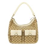 GUCCI - an Abbey Pocket hobo handbag. Designed with maker's GG monogram canvas exterior with grained