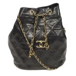 CHANEL - a vintage bucket handbag. Crafted from black diamond quilted leather, with gold-tone