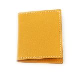 HERMÈS - a mini mustard yellow leather picture frame. Opening to two small picture frame windows.