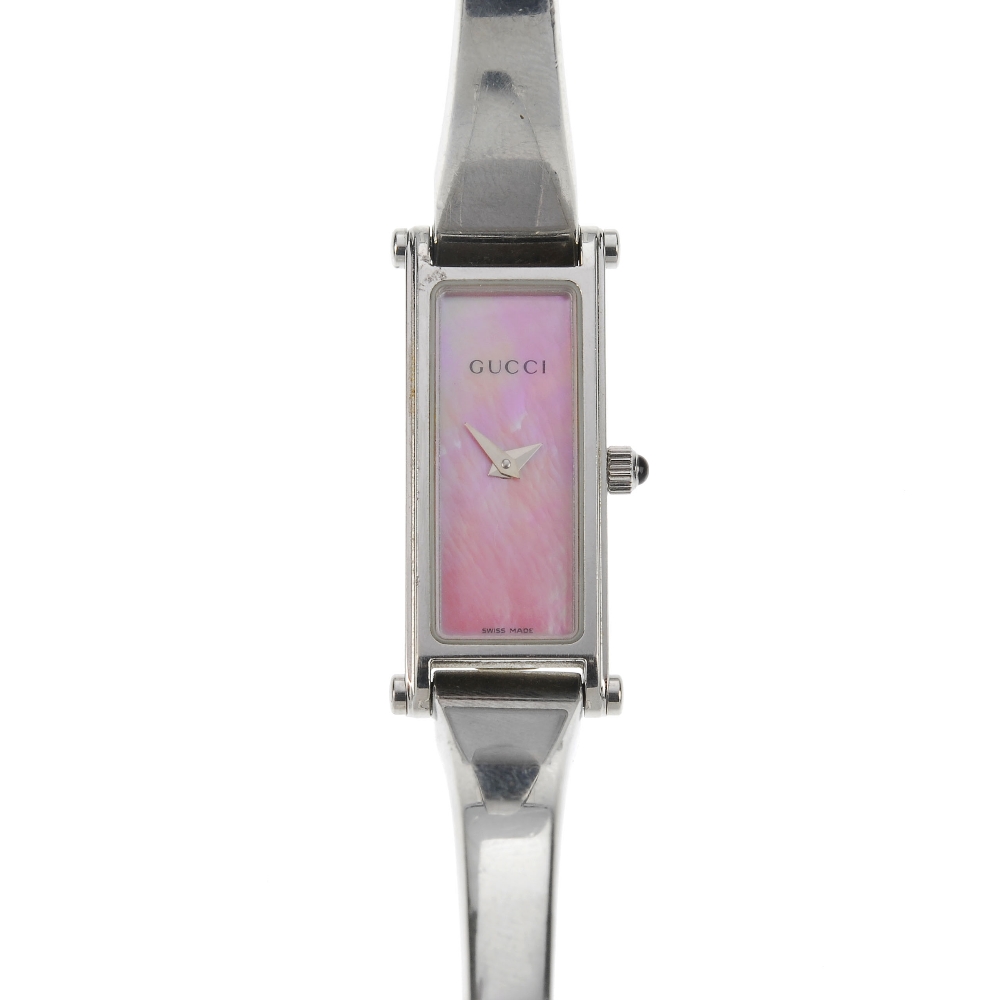 GUCCI - a stainless steel quartz lady's 1500L bangle watch. The pink mother-of-pearl dial, with a