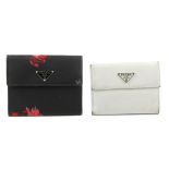 PRADA - two purses. Both of a similar style, to include a white Saffiano leather purse with maker'