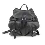 PRADA - a black Nappa leather rucksack. Featuring a top flap with a buckle fastening and inner