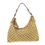 GUCCI - a Horsebit hobo handbag. Crafted from maker's classic GG canvas, with beige leather trim,