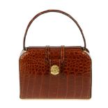 CÉLINE - a vintage crocodile handbag. Designed with a structured shape, crafted from brown crocodile