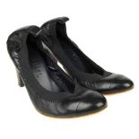 CHANEL - a pair of black leather heels. Featuring a black leather toe cap and block heel with