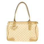 GUCCI - a Princy handbag. Featuring a beige GG canvas exterior with metallic gold leather trim and