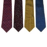 FENDI - four silk ties. To include a navy blue tie with a pattern of squares and star signs, a red