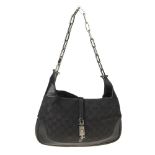 GUCCI - a black Jackie Chain handbag. Designed with maker's black monogram canvas exterior, polished